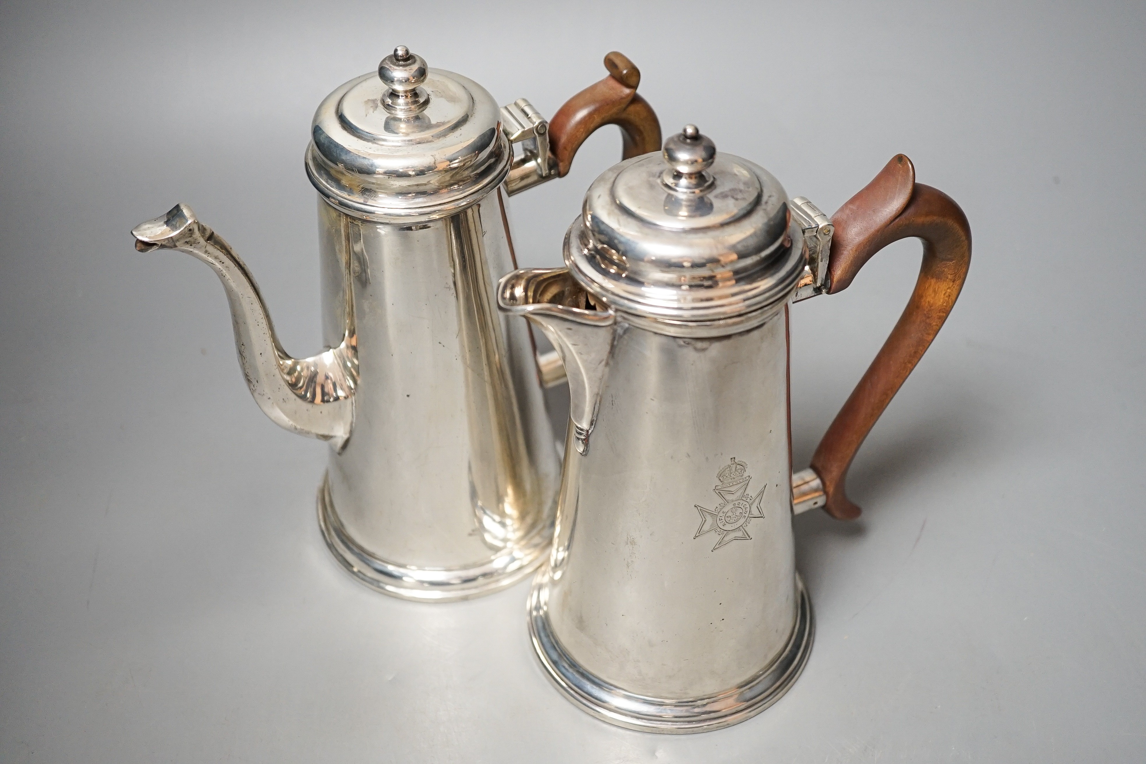 A George V cafe au lait pair, by Tessiers Ltd, London, 1924, engraved with Rifle Brigade crest, height 19.4cm, gross 33oz.
